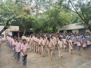 Hundreds of government school students gathered at the Dhamal Village awareness programme