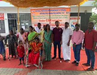 A beneficiary takes the controls of his new NeoMotion wheelchair bike for the first time
