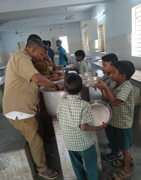 Children receive freshly cooked meals at the Government Children Home for Boys, Ranipet